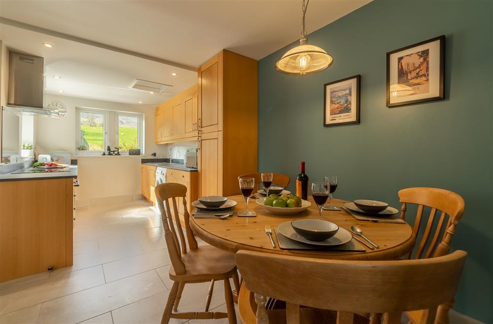 Kitchen with dining area seating four guests (photo 2) at 1 Riverside Cottages, Skipton, North Yorkshire