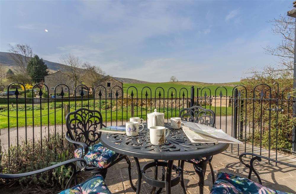 Patio seating area and a beautiful view at 1 Riverside Cottages, Skipton, North Yorkshire