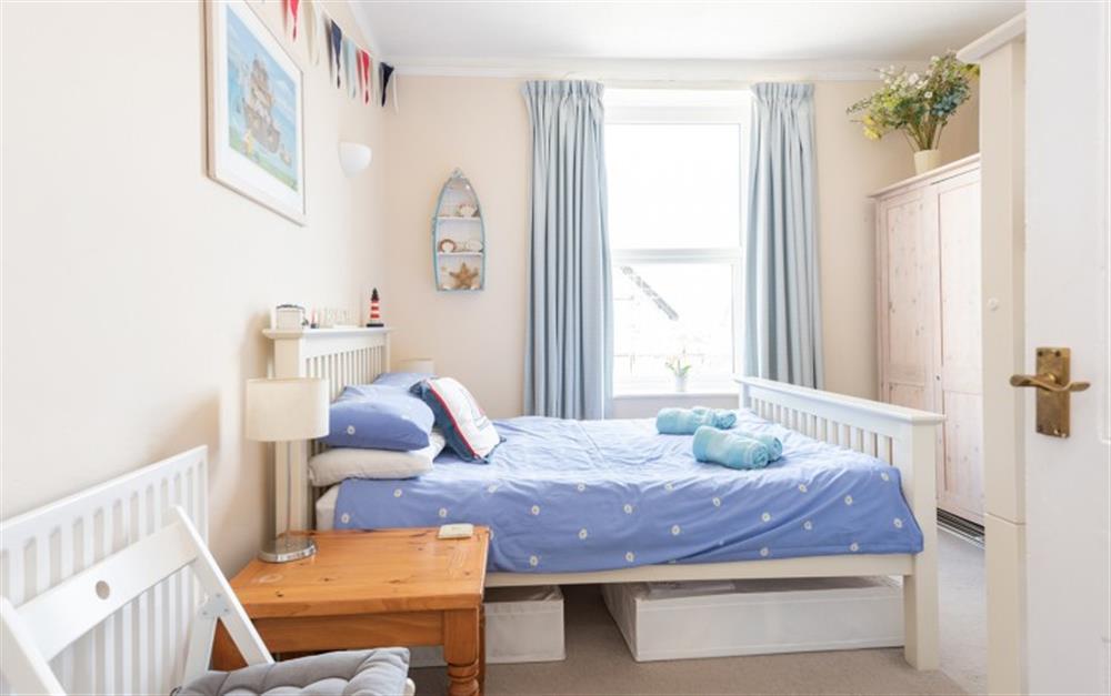 Bedroom 2 with double bed and bunk beds  at 1 Roborough Court in Salcombe