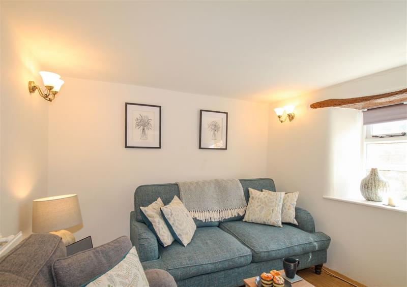 Relax in the living area at 1 Rose Cottage, Shipton Gorge