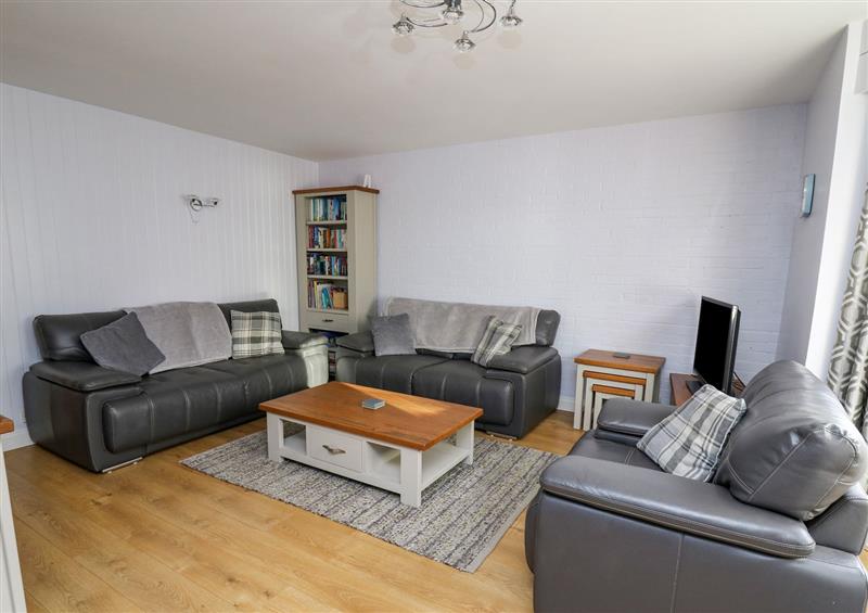 Relax in the living area at 1 St. Marys Court, Tenby