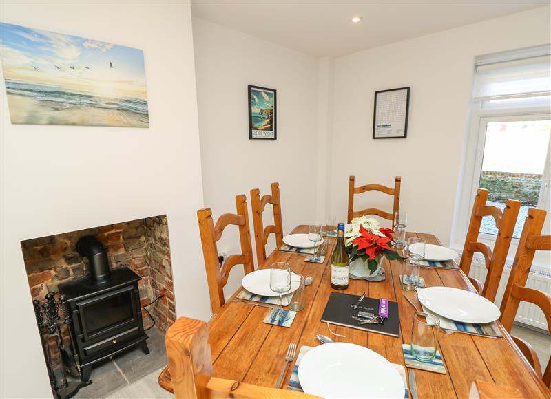 Relax in the living area at 1 Star Cottages, Freshwater