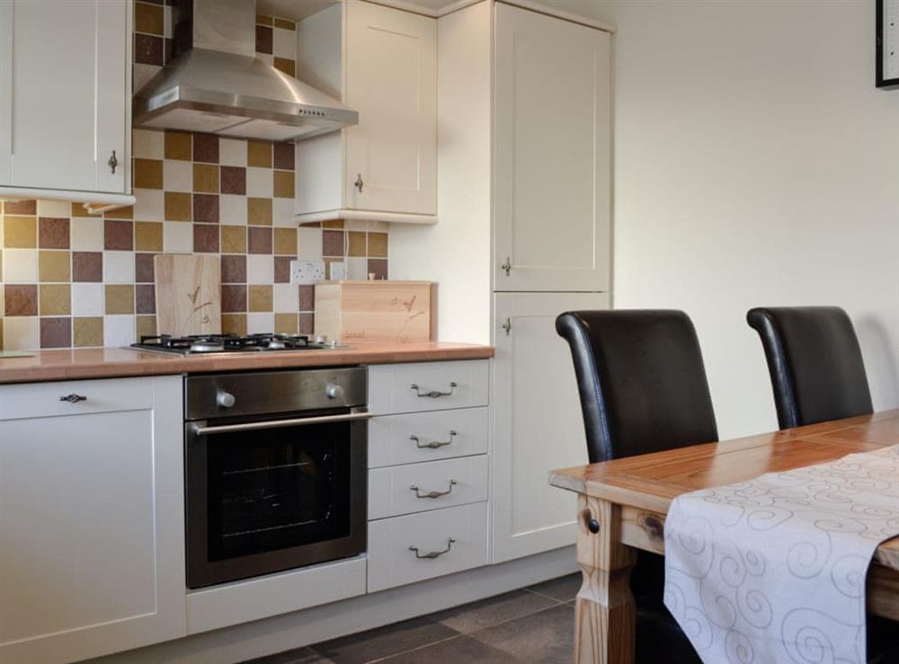 Kitchen with dining area at 1 The Costins in Allonby, near Maryport, Cumbria
