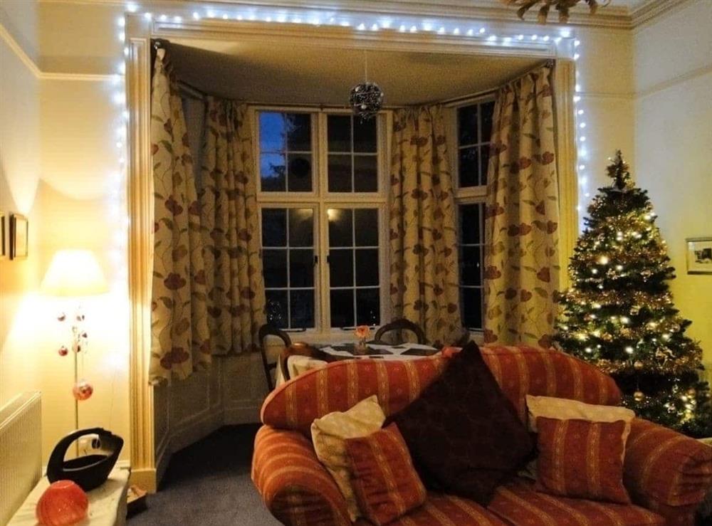 Christmas sparkle adds seasonal cheer to the living/dining room at 1 The Knoll in Ambleside, Cumbria