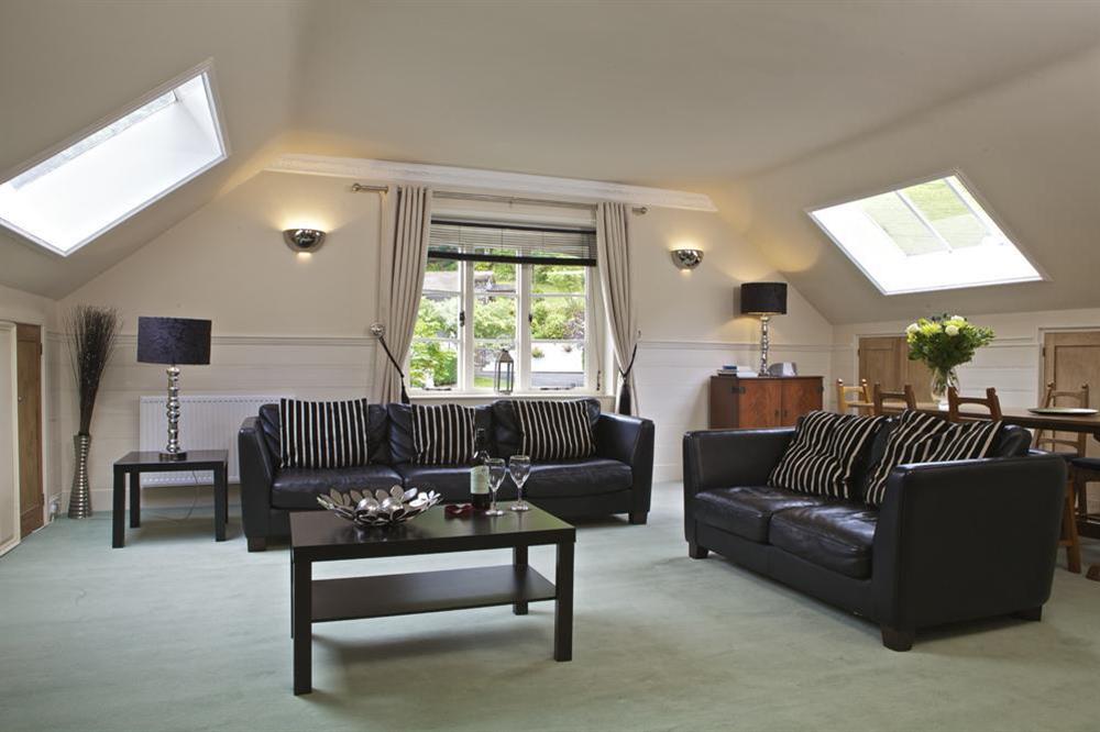 Comfortable lounge with two leather sofas (photo 2) at 1 The Old Coach House in Warfleet Creek, Dartmouth