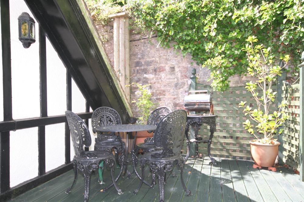 Decked balcony with table and chairs