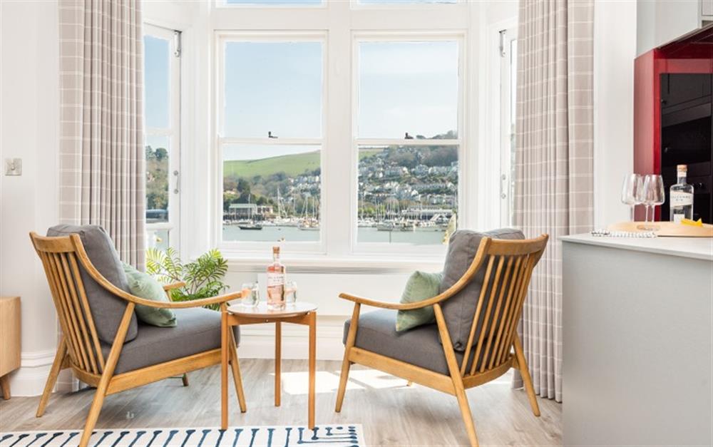 Armchairs with views across the river towards Kingswear at 1 The Quay in Dartmouth