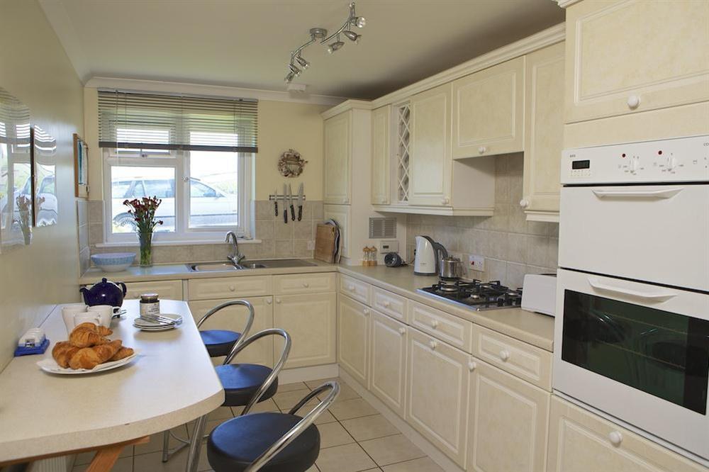 Kitchen with breakfast bar and stools at 1 Thurlestone Rock Apartments in Thurlestone, Kingsbridge