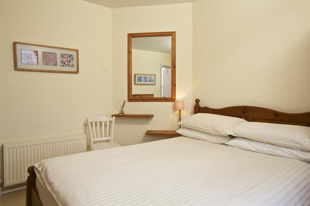 Master bedroom with double bed at 1 Top View Cottages in Bonaventure Road, Salcombe