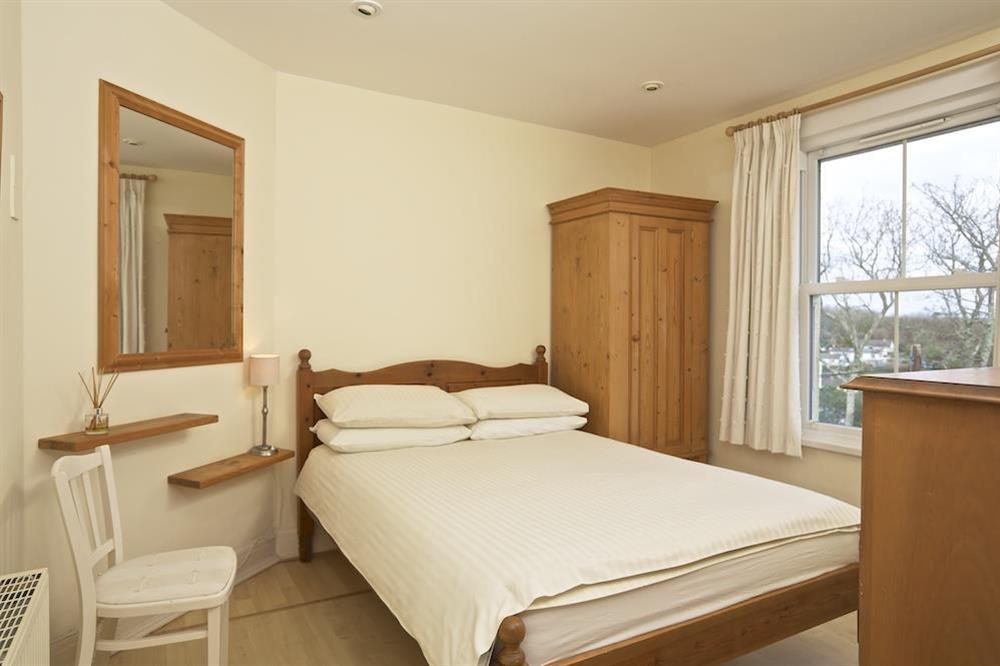 Master bedroom with en suite bathroom at 1 Top View Cottages in Bonaventure Road, Salcombe