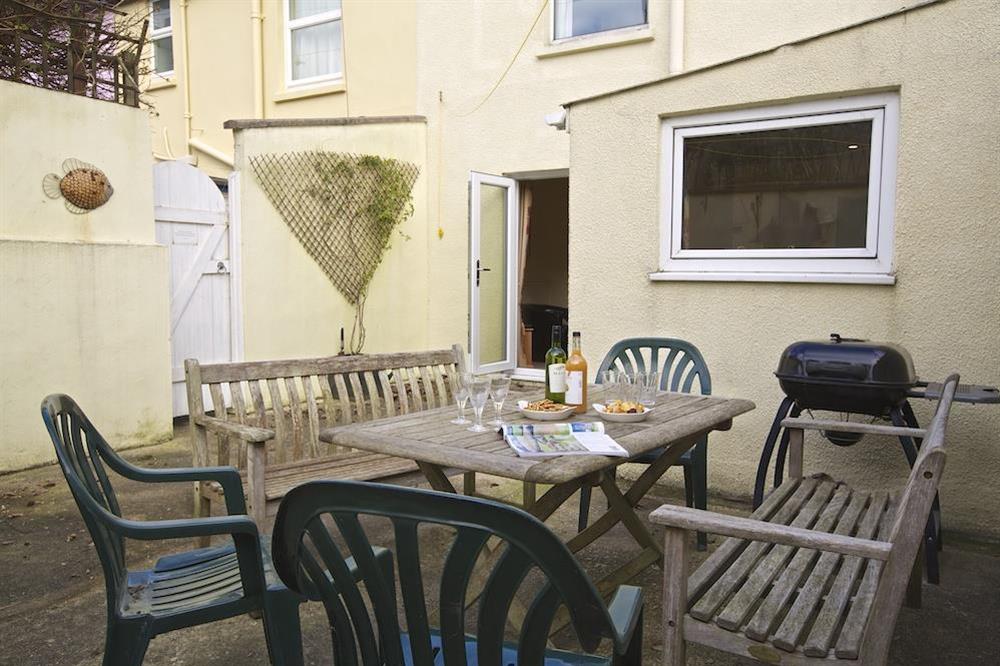 Outdoor dining area perfect for barbecues and evening drinks at 1 Top View Cottages in Bonaventure Road, Salcombe