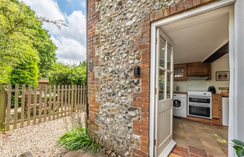 The kitchen door leads out to a shared pathway at the back of the cottage at 10 Burnham Road, North Creake near Fakenham