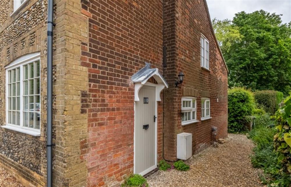 The side path and entrance door to the cottage at 10 Burnham Road, North Creake near Fakenham