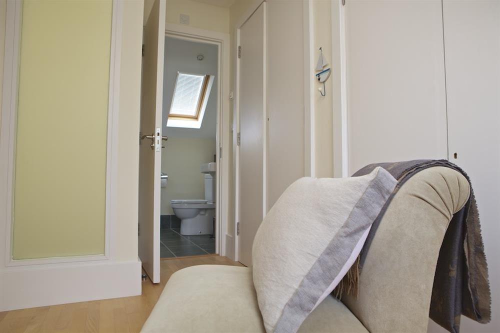 The nursery room has access to an en suite bathroom at 10 Combehaven in , Salcombe