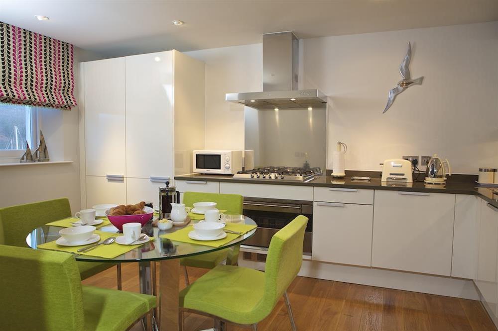 Kitchen with Poggenpohl fitted units and glass topped dining table at 10 Dart Marina in , Dart Marina