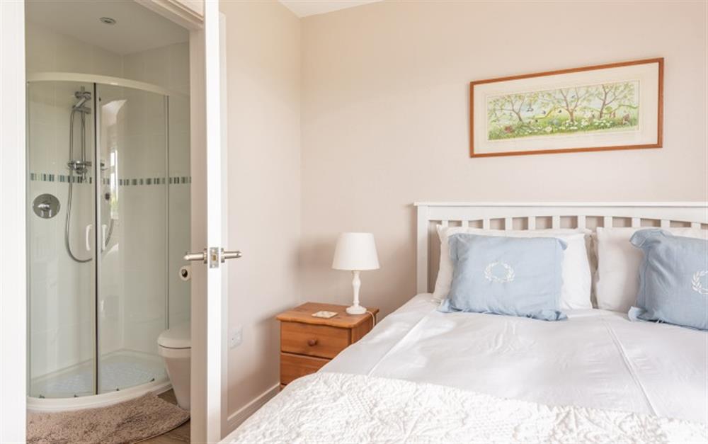 Master bedroom with en suite shower  at 10 Old Rectory Gardens in Thurlestone