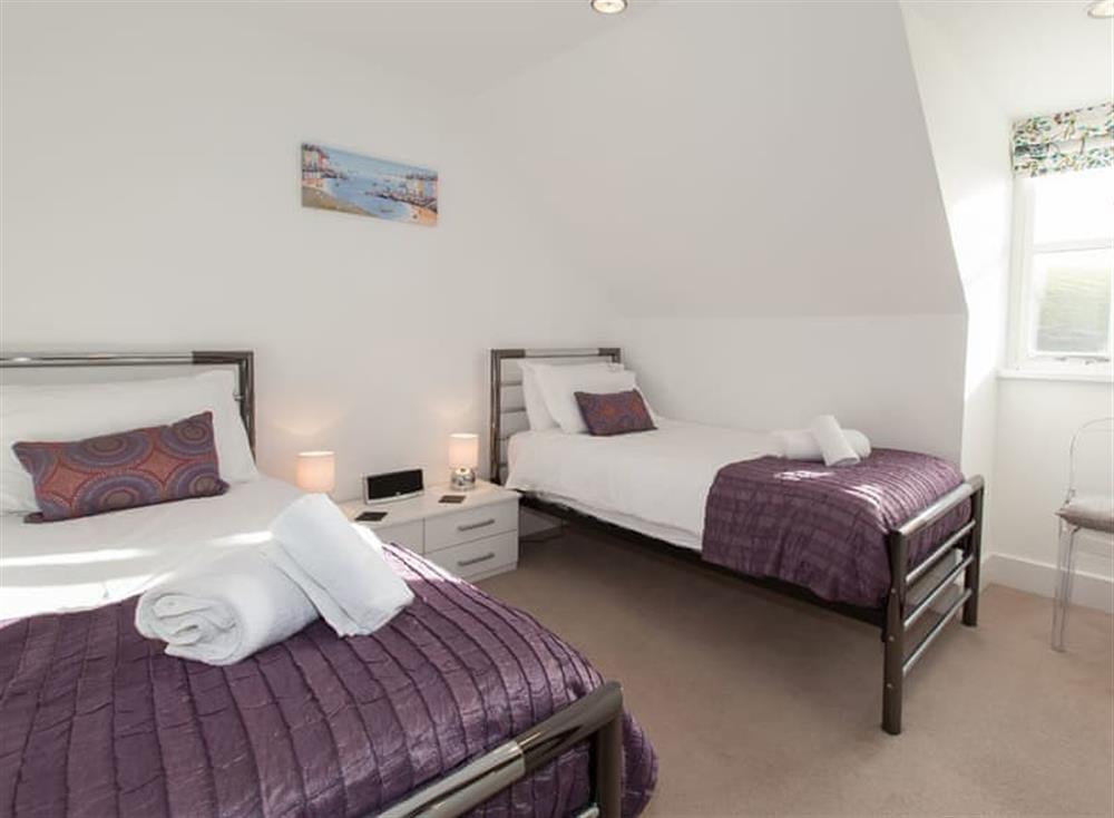 Twin bedroom at 10 The Whitehouse in North Cornwall, Watergate Bay & Mawgan Porth