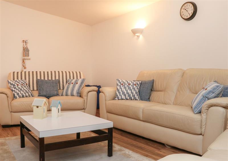 Relax in the living area at 11 Cove View Apartments, Ilfracombe
