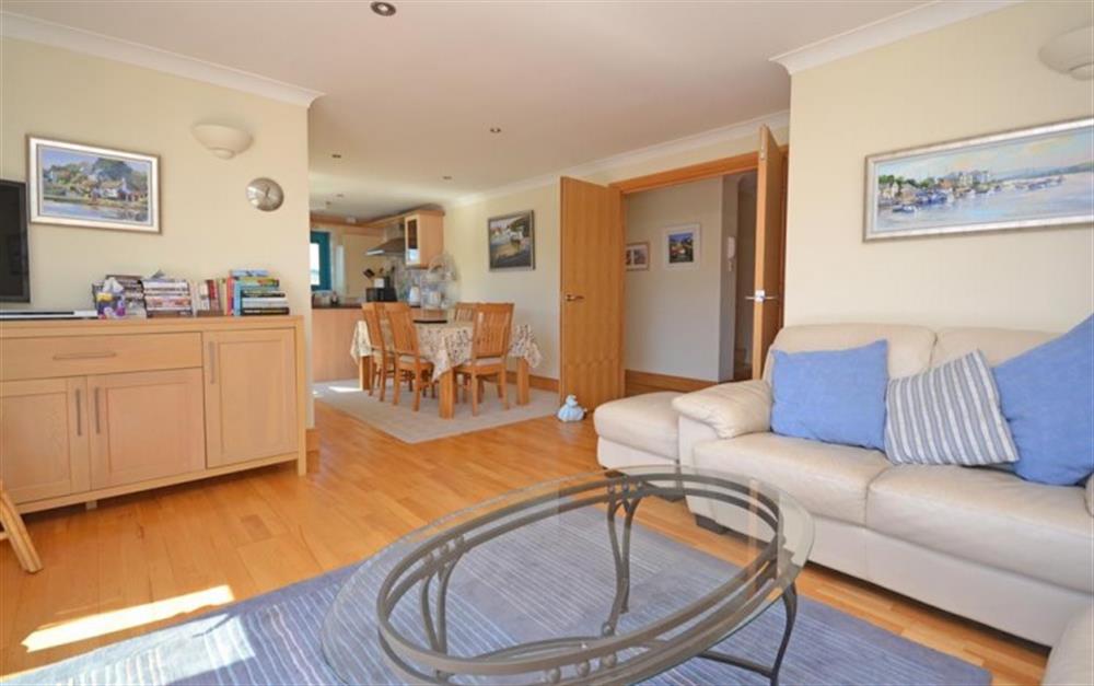 The light and spacious open plan living, dining and kitchen area at 11 Crabshell Quay in Kingsbridge