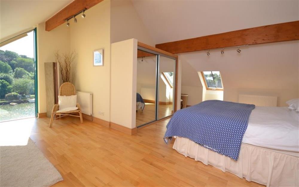 The master bedroom with waterside views at 11 Crabshell Quay in Kingsbridge