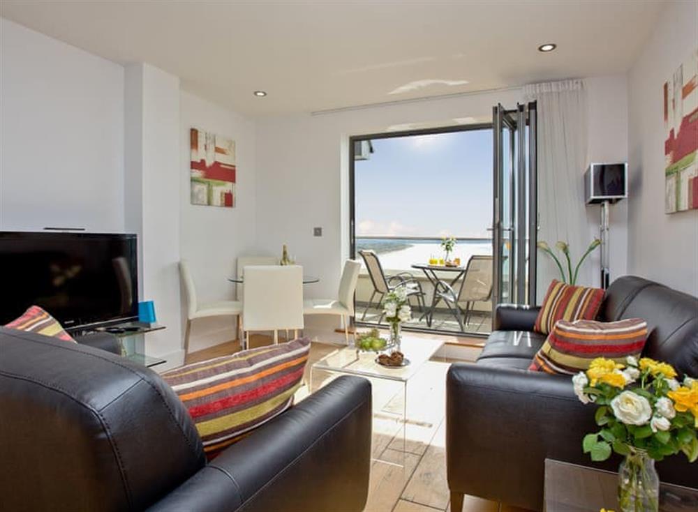 Relaxing open living area with compact dining area at 11 Ocean Point Penthouse in , Saunton & Braunton