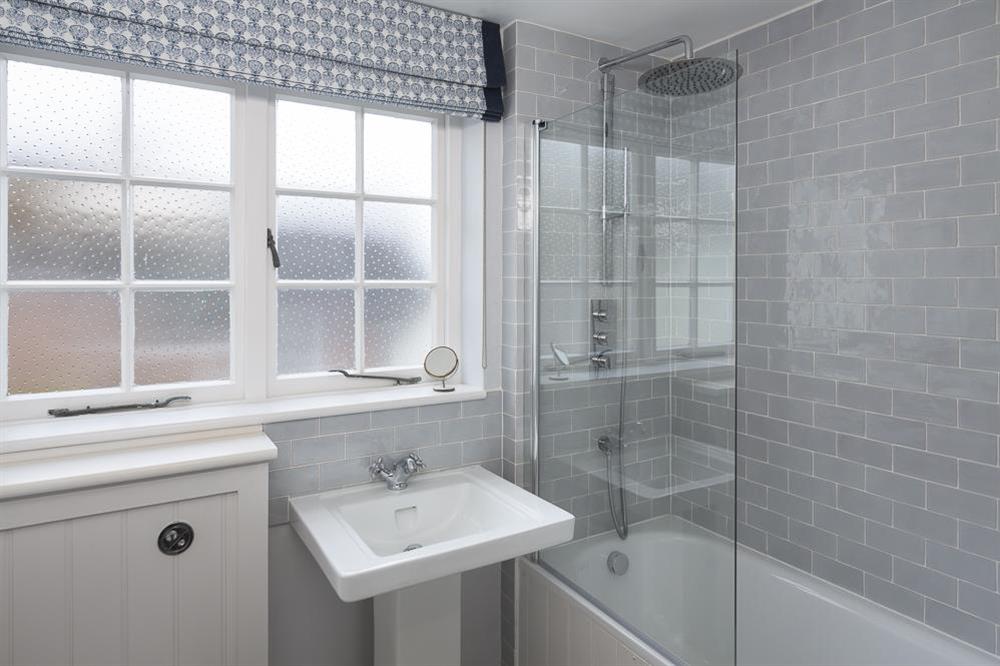 Fully tiled family bathroom at 11 Robinsons Row in , Salcombe