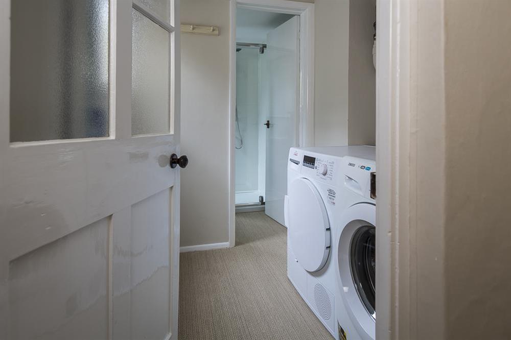 Utility room with washing machine and tumble dryer at 11 Robinsons Row in , Salcombe