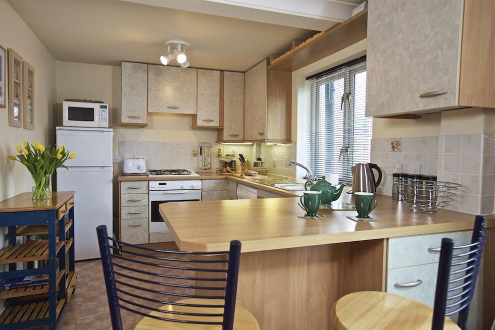 Kitchen with breakfast bar at 12 Dartmouth House in , Dartmouth