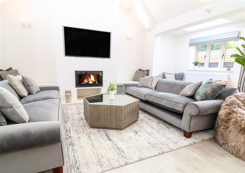 Relax in the living area at 12 Manor Farm Close, Kingham