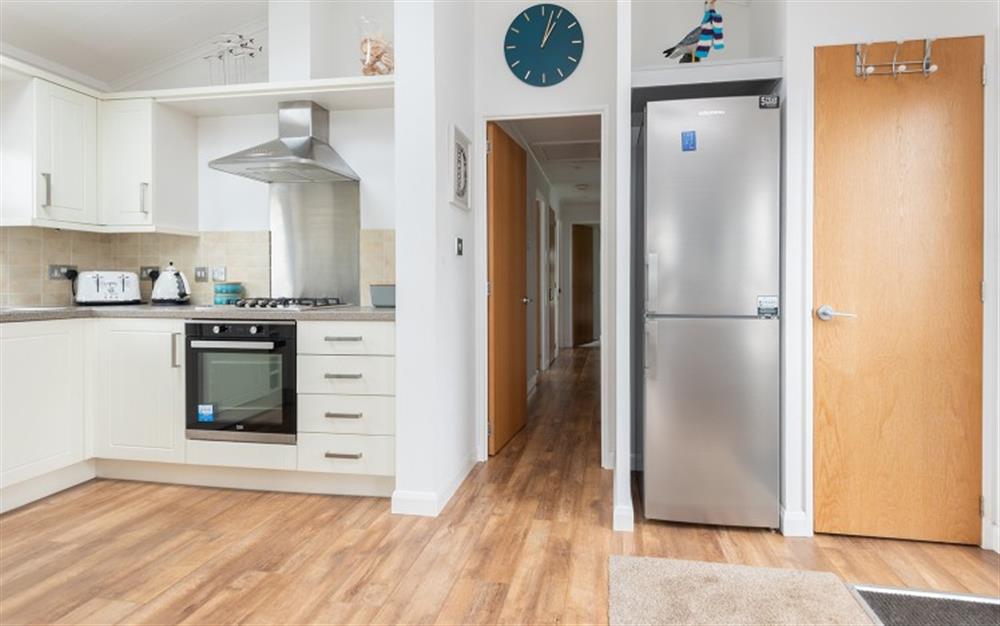 The kitchen with large fridge freezer. at 12 Salcombe Retreat in Salcombe