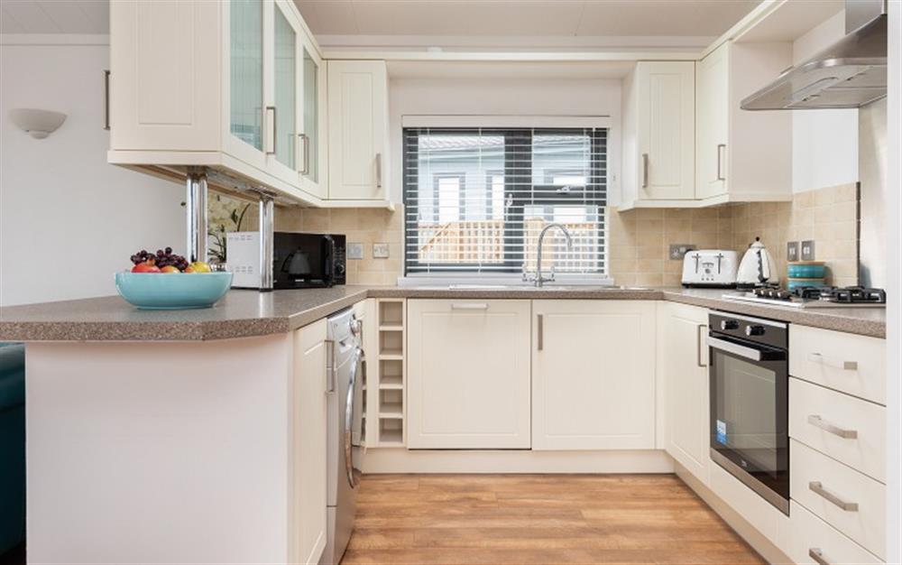 The well equipped kitchen, including a washer/dryer. at 12 Salcombe Retreat in Salcombe