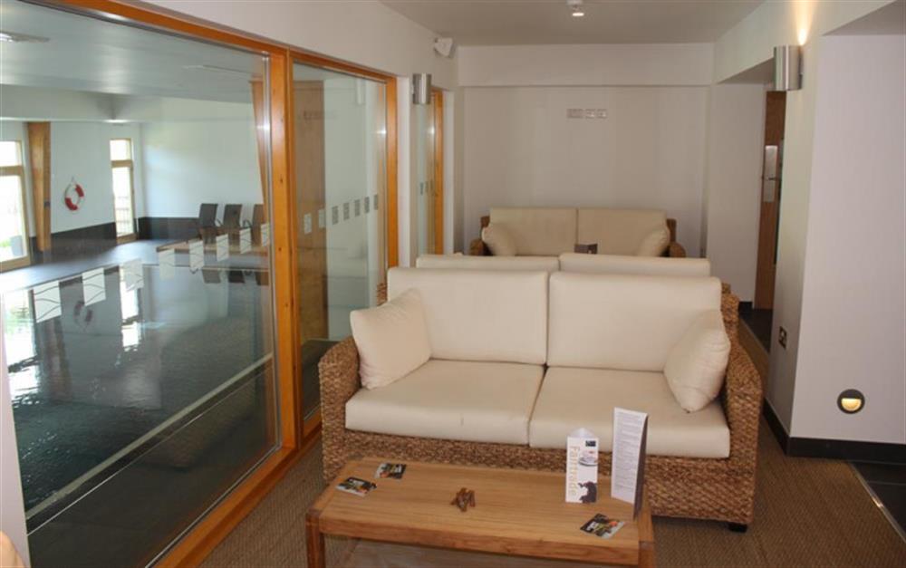 Seating in the reception area by the indoor pool at 12 Talland in Talland Bay