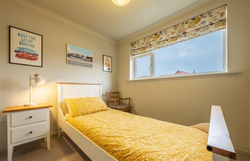First floor: Bedroom two with full-size single bed at 12 The Close, Brancaster Staithe near Kings Lynn