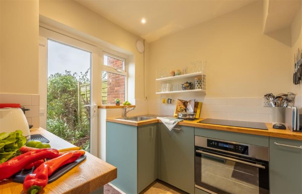 Ground floor: A compact but well-equipped fitted kitchen at 12 The Close, Brancaster Staithe near Kings Lynn