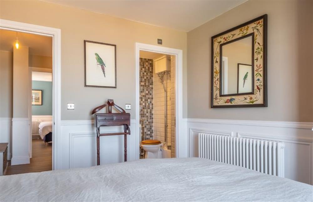 Master bedroom with door to en-suite at 13 Burlington Place, Sheringham