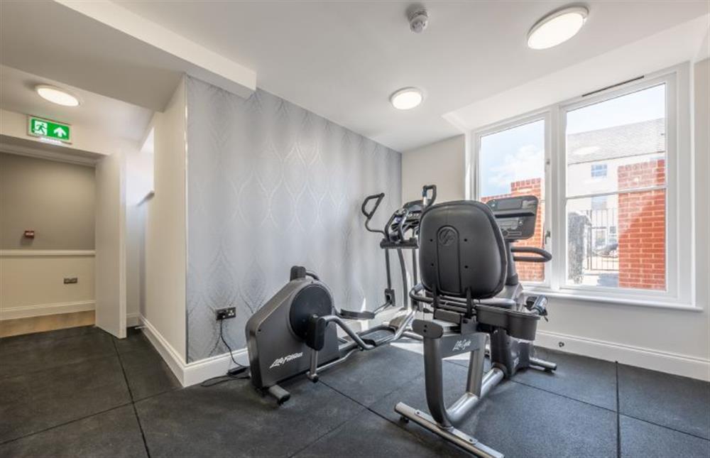 There is a gym in the basement. There is also a running machine, which is not in the photo at 13 Burlington Place, Sheringham