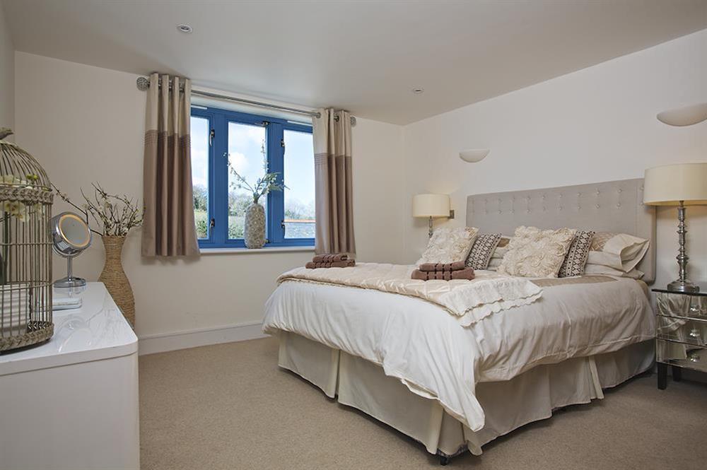 En suite master bedroom with super-King size bed at 13 Crabshell Heights in , Kingsbridge