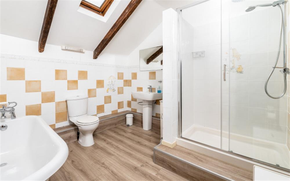 The bathroom complete with separate shower cubicle and roll top bath at 14 Beesands in Beesands