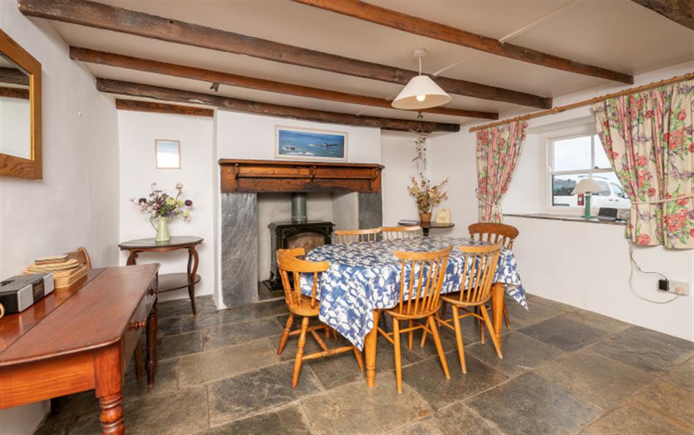 The dining room with exposed beams at 14 Beesands in Beesands