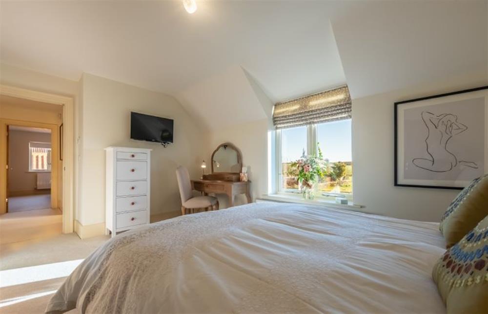 First floor: Master bedroom with television at 14 Burnham Road, Ringstead near Hunstanton