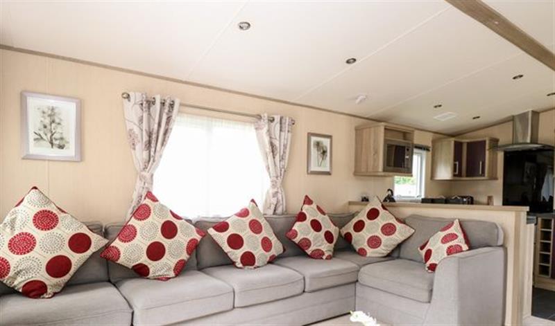Relax in the living area at 14 Foxburrow Hang, Fritton