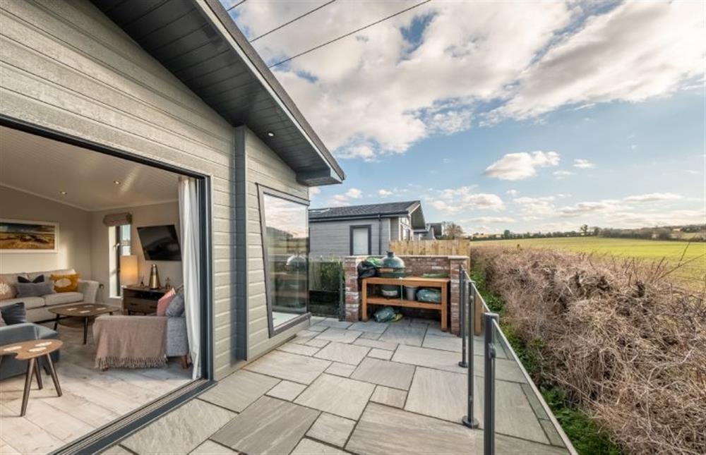 Enjoy a sundowner and a barbecue on the west facing balcony at 14 Westgate, Burnham Market near Kings Lynn