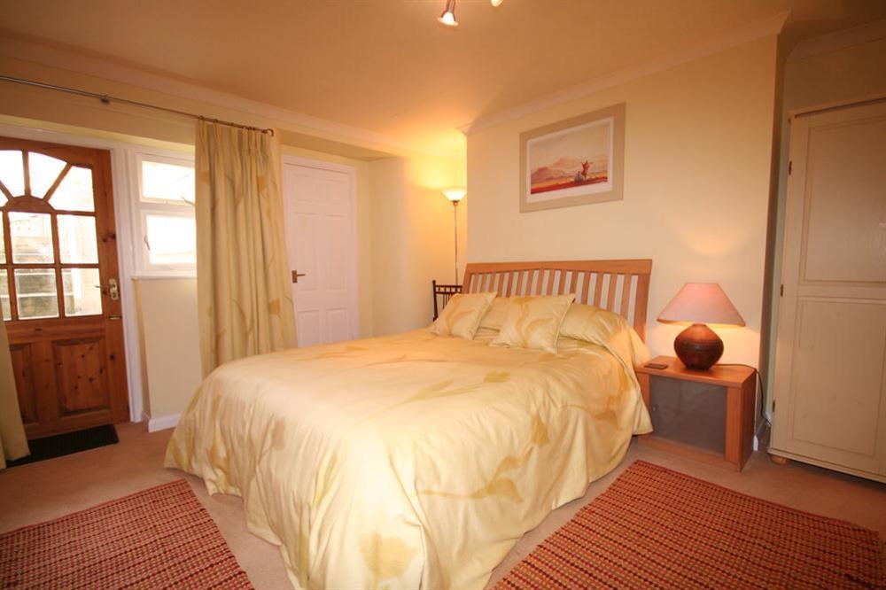 Double bedroom with en suite and door to terrace at 14a Courtenay Street in , Salcombe