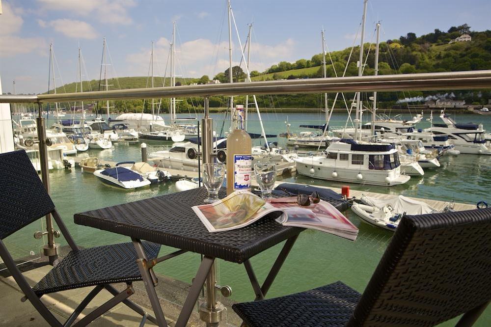 Lovely balcony with wonderful river views, small table and two chairs at 15 Dart Marina in Sandquay Road, Dartmouth