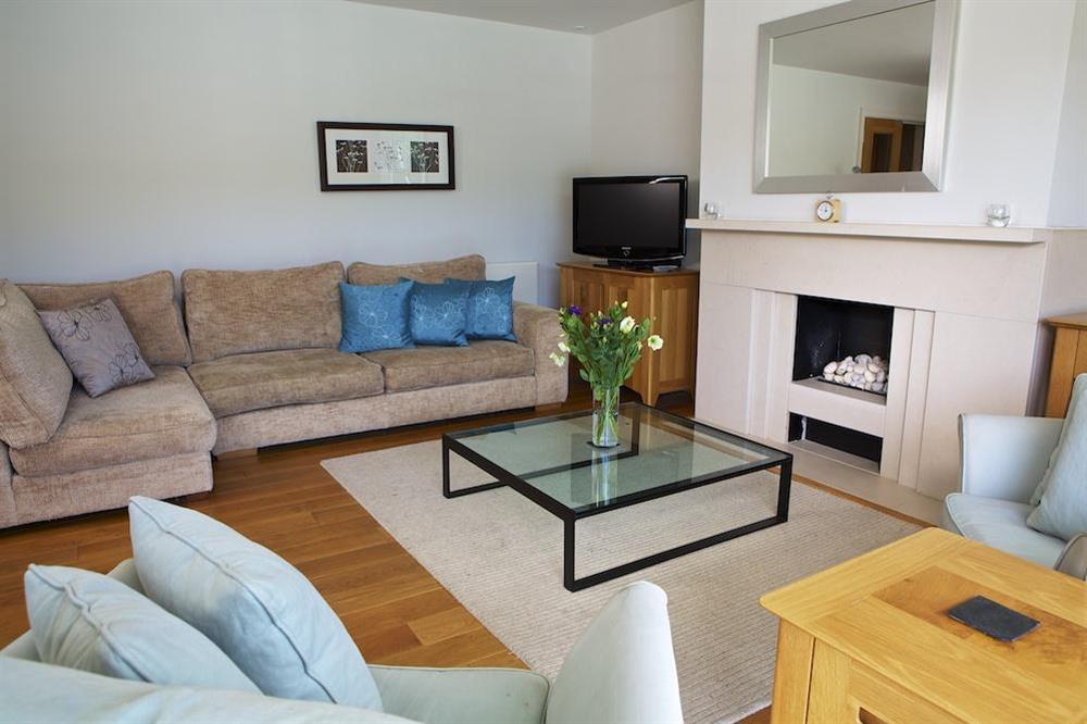 Stylishly elegant lounge with doors out to the balcony at 15 Dart Marina in Sandquay Road, Dartmouth