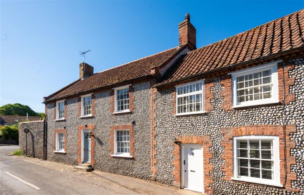 154, with the white door, is at the top end of Blakeney High Street. Parking is on road, at the front of the cottage