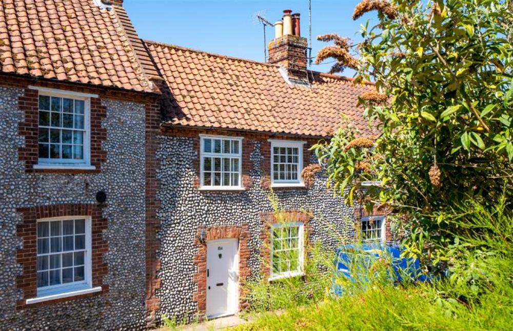 A brick and flint, mid-terrace fisherman’s cottage located in the heart of the coastal village of Blakeney