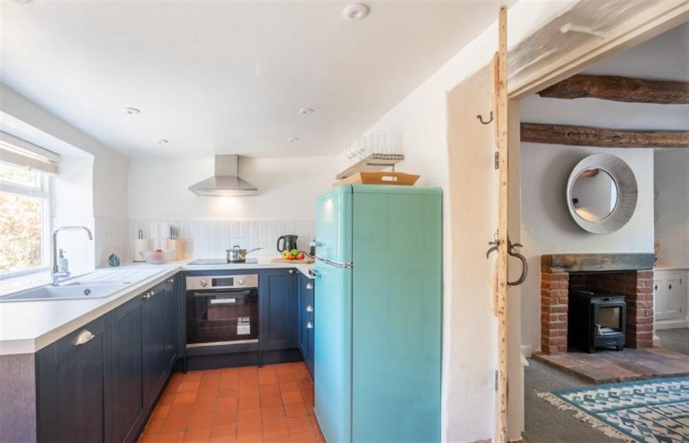 Kitchen with electric cooker and hob, microwave, dishwasher and fridge/ freezer at 154 Blakeney High Street, Blakeney near Holt