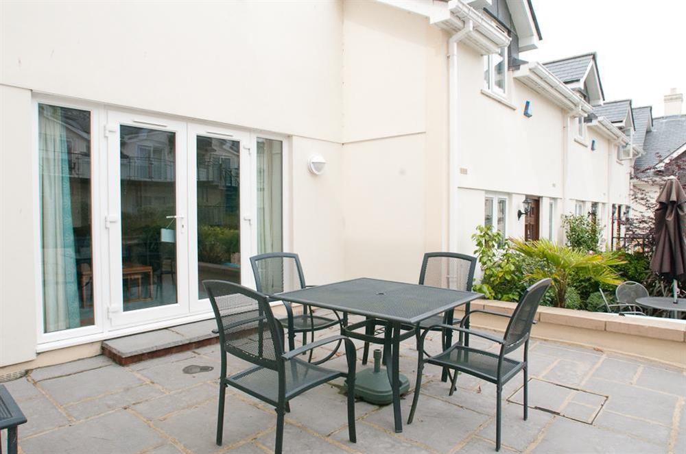 Terrace with table and four chairs at 16 Bolt Head in South Sands, Salcombe