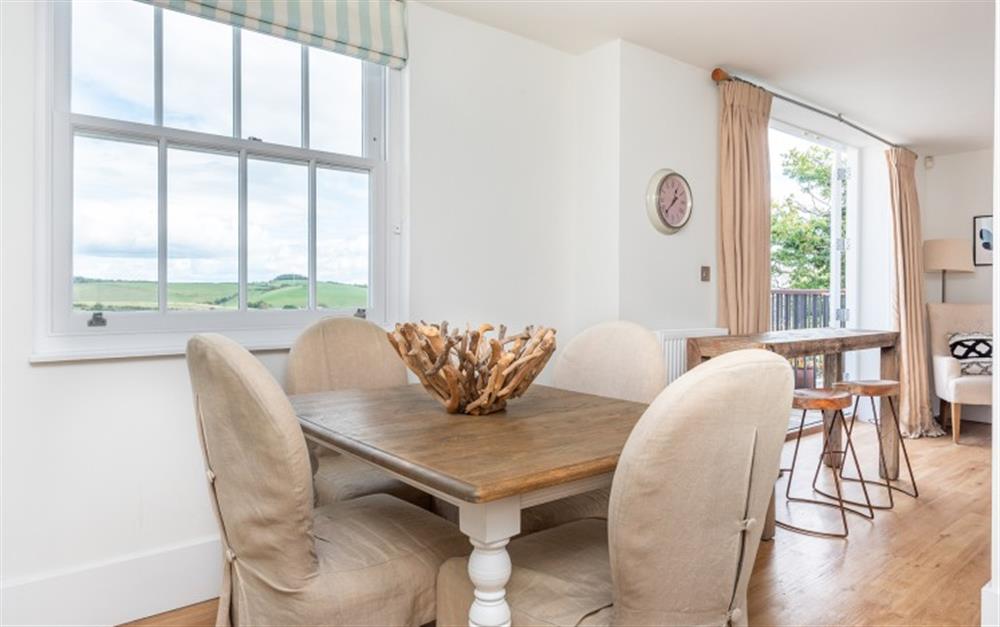 Dining area with a water view at 16 Combehaven in Salcombe
